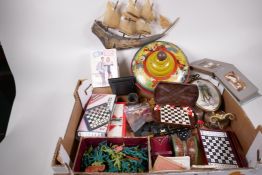 Miscellaneous items including an Oriental carved bone boat, spinning top, games, toys etc