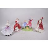 Four Royal Doulton porcelain figurines, 'The Milestone', 'The Paisley shawl', 'Top of the Hill'