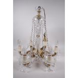 A brass and cut crystal glass chandelier, with six lights, 19" high, 18" diameter