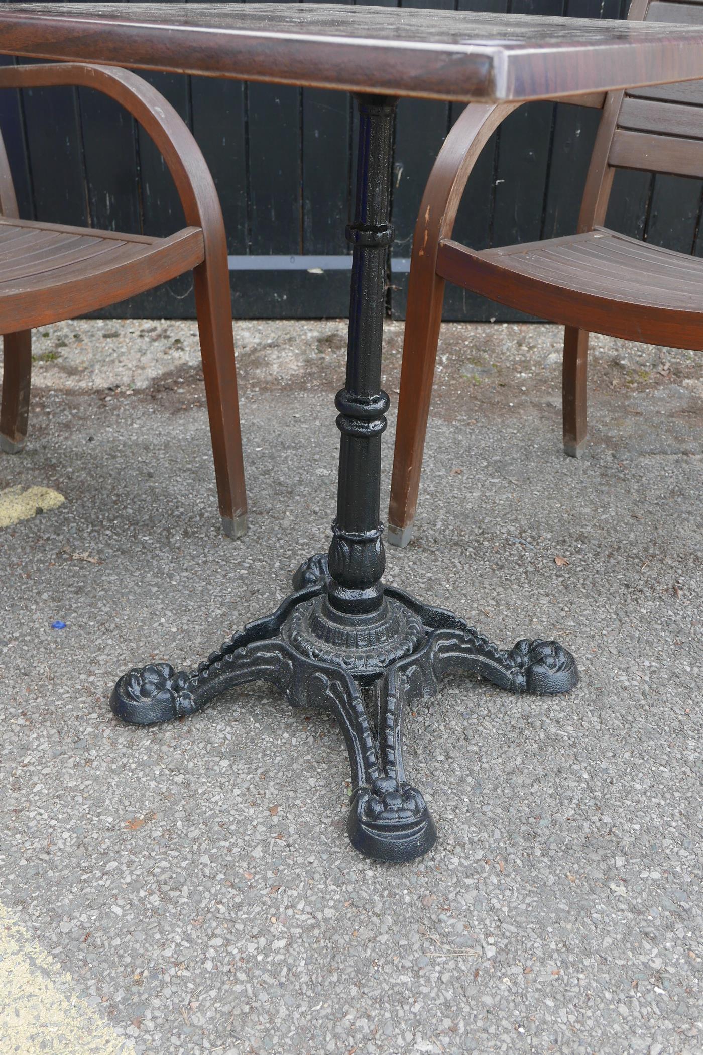 Two teak garden elbow chairs and a wrought iron and plastic bistro table, 23" x 23", 29" high - Image 2 of 3