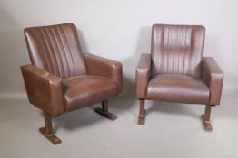 A pair of vintage leatherette cinema stalls