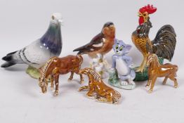 A Beswick porcelain figure of a wood pigeon, 5½" high, together with a Goebel porcelain figure of