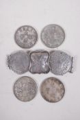 Four facsimile white metal coins and a white metal and coin set belt buckle, coins 1½" diameter