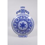 A blue and white porcelain two handled moon flask decorated with the eight Buddhist symbols,