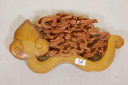 A vintage Chinese soapstone carving of a ruyi and seven dragons, 17" x 9"