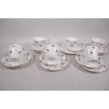 A six place setting Argyle pattern bone china tea service of cups, saucers and plates (18)