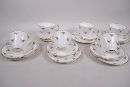 A six place setting Argyle pattern bone china tea service of cups, saucers and plates (18)