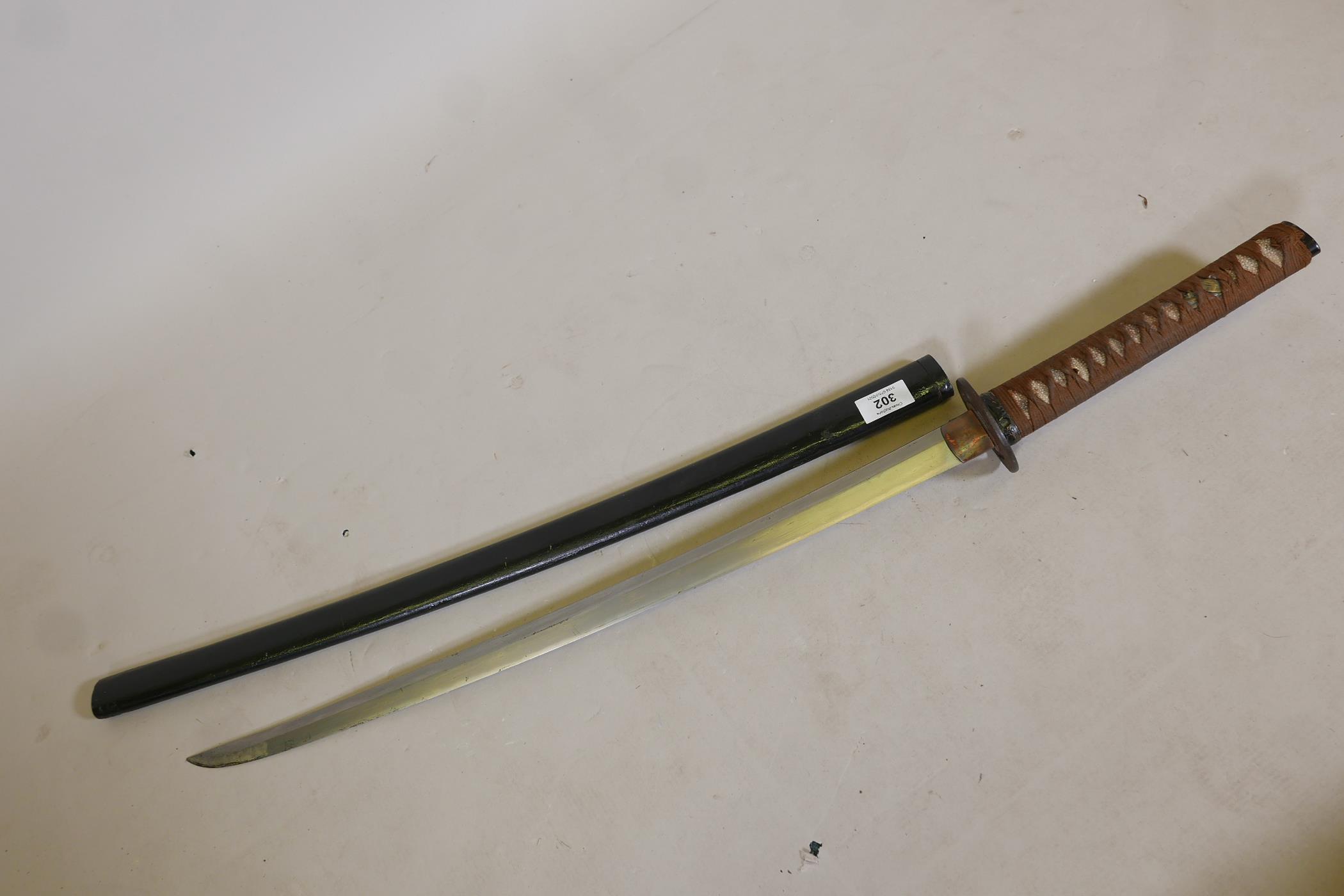 An antique Japanese sword, probably C17th, with later shagreen handle, brass menuki and iron - Image 2 of 9