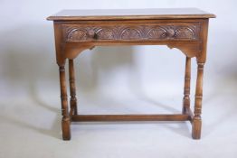 An Old Charm oak hall table with single frieze drawer and turned supports, 30" high, 36" wide, 17"