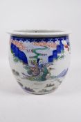 An early C20th Chinese famille verte porcelain jardiniere decorated with Immortals in a landscape,