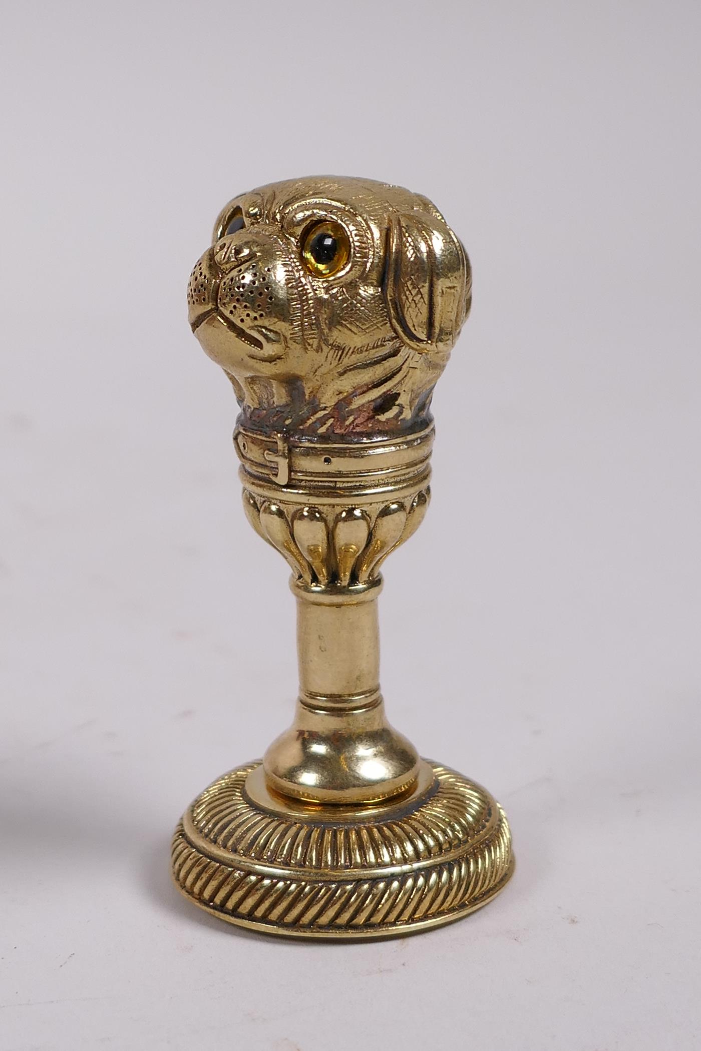 A brass document seal, the handle in the form of a pug's head, 2"