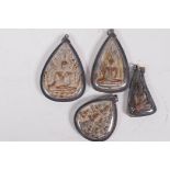 Four Tibetan Buddhist pendants, largest 3" long