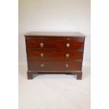 A C19th mahogany chest of three long drawers, under a brushing slide, raised on bracket supports,