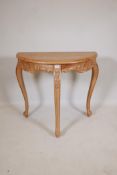 A pine demi lune console table, with carved frieze, raised on cabriole supports, 32" x 16" x 30"