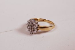 A 9ct yellow gold ring set with a cluster of diamonds, 0.5ct, 2.8g, size 'K'