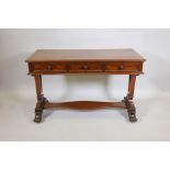 A Regency mahogany side table with three frieze drawers on ornate pierced end supports with