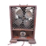 A vintage mahogany case ozone generator from Ozonair, London, 12½" high