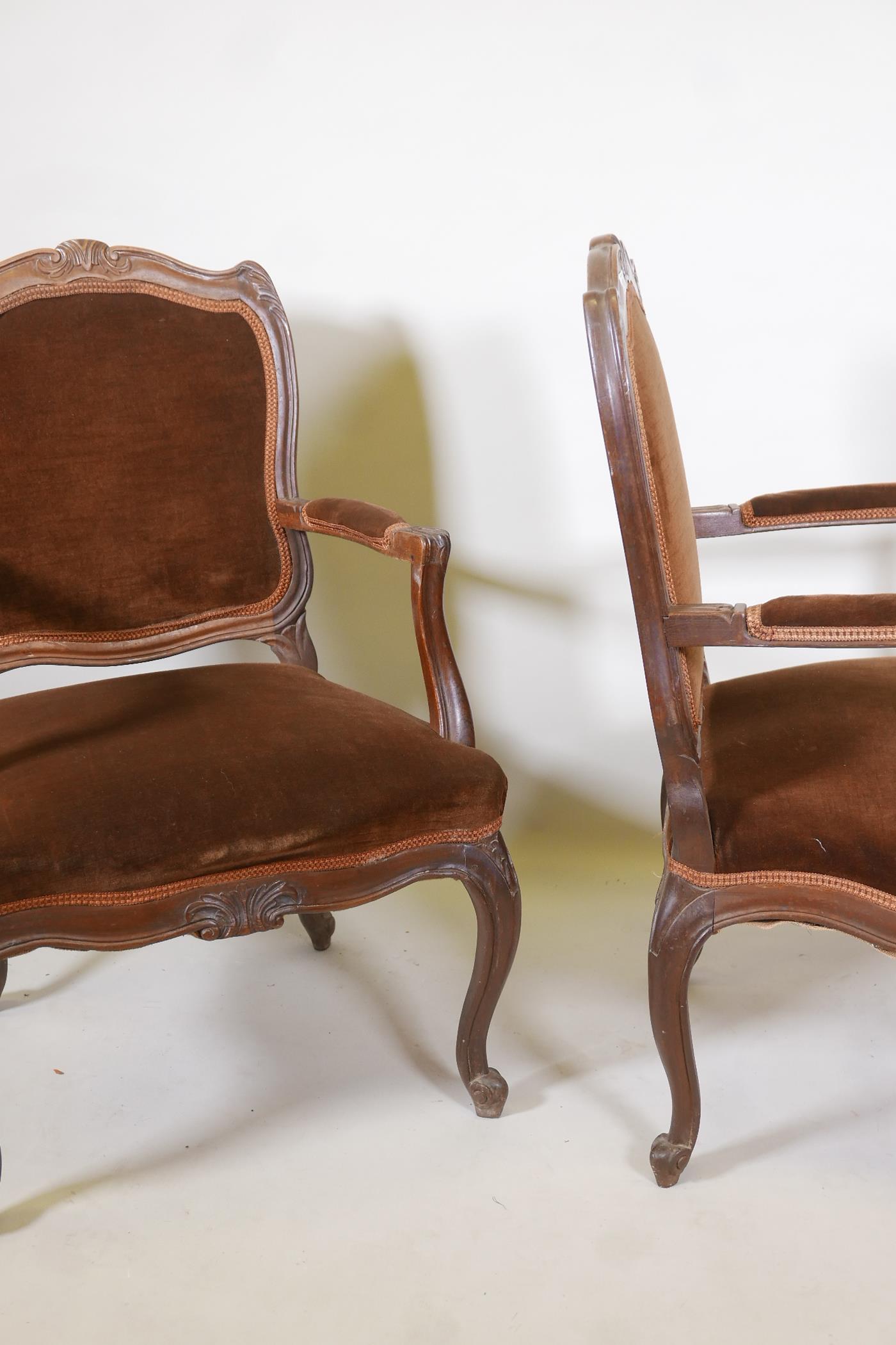 A pair of Continental walnut open armchairs on scroll feet with carved details, 38" high - Image 4 of 4