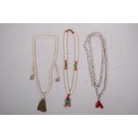 Three strings of bone mala beads, longest 57"