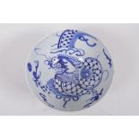A Korean pottery blue and white bowl painted with a dragon, 6½" diameter