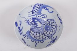 A Korean pottery blue and white bowl painted with a dragon, 6½" diameter