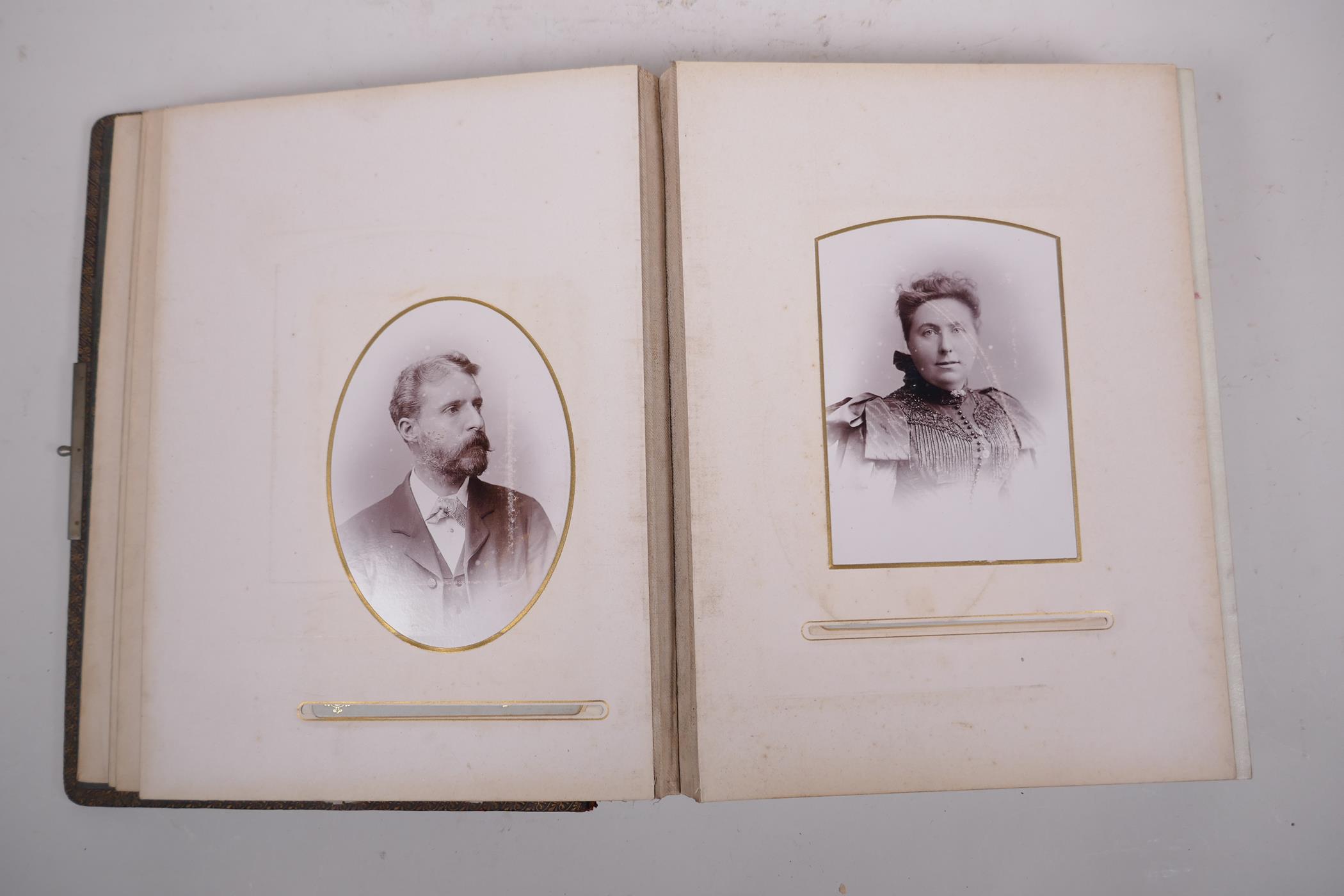 A late C19th/early C20th German leather bound photograph album containing portrait photos from the