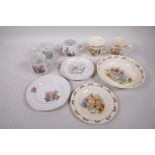 A Royal Doulton Bunnykins plate, 6½", mugs, bowl A/F, and Wedgwood Peter Rabbit two handled cup