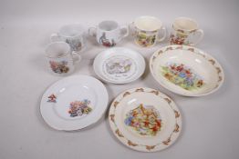 A Royal Doulton Bunnykins plate, 6½", mugs, bowl A/F, and Wedgwood Peter Rabbit two handled cup