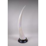 A lustre glazed ceramic tusk, 27½"