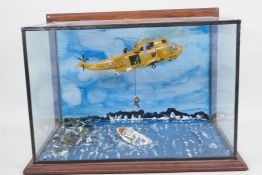 An RAF helicopter rescue diorama, glass cased, 15½" wide