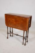 A Victorian burr walnut drop leaf occasional table, with inlaid border, raised on slender turned