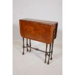 A Victorian burr walnut drop leaf occasional table, with inlaid border, raised on slender turned