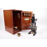 A Baker of London '9573' microscope, cased, 12" high