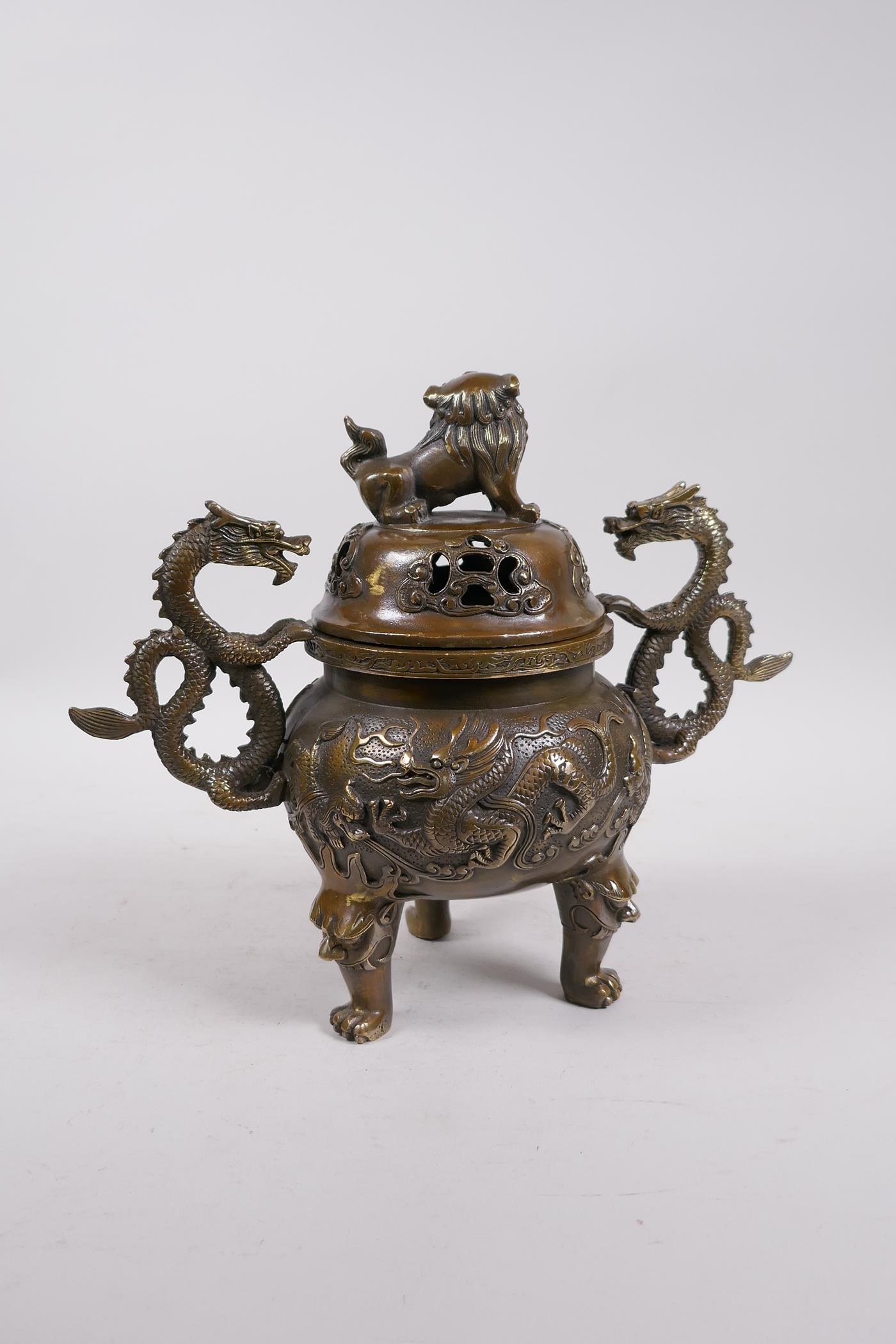 A Bronze Chinese dragon censer and cover with two handles and a fo dog knop, raised on tripod - Image 5 of 6