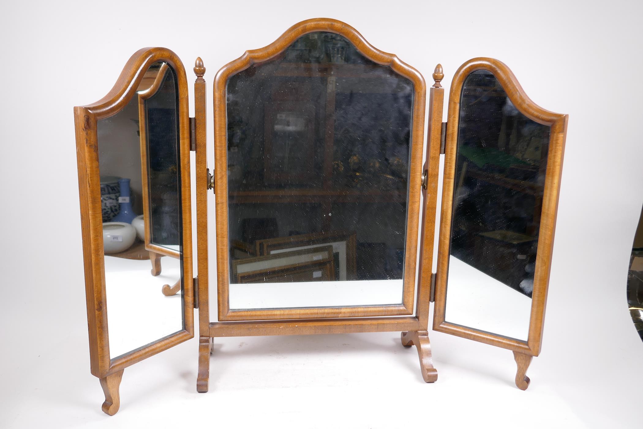 A Queen Anne style walnut triptych dressing table mirror, 29½" high