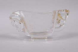 A Chinese moulded glass libation cup with pierced dragon decoration, 4½" long