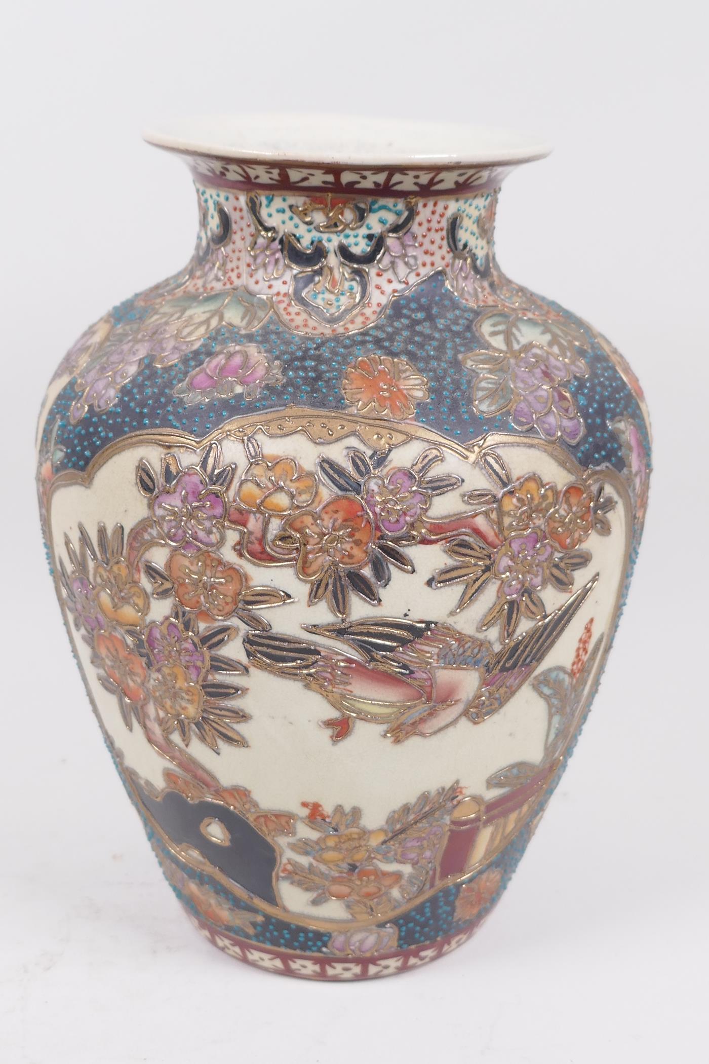 An Oriental porcelain vase, with cloisonne style decoration of birds and flowers, seal mark to base,