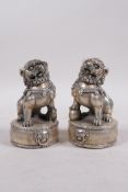A pair of Chinese filled white metal fo dogs, 4 character mark to base, 4½" high