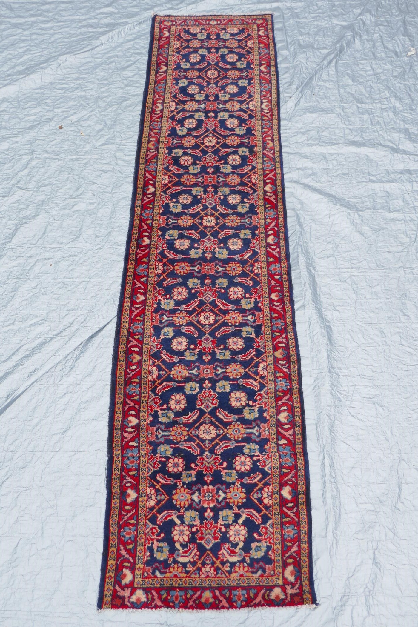 A blue ground Persian Sarouk runner with all over design and red borders, 33" x 140" - Image 2 of 8