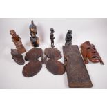 A collection of African carved wood figures and masks etc, including a Benin carved panel, A/F,