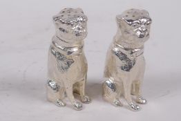 A pair of silver plated table salts cast as seated pug dogs, 2½" high
