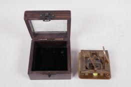 A boxed brass sundial compass, 3" square