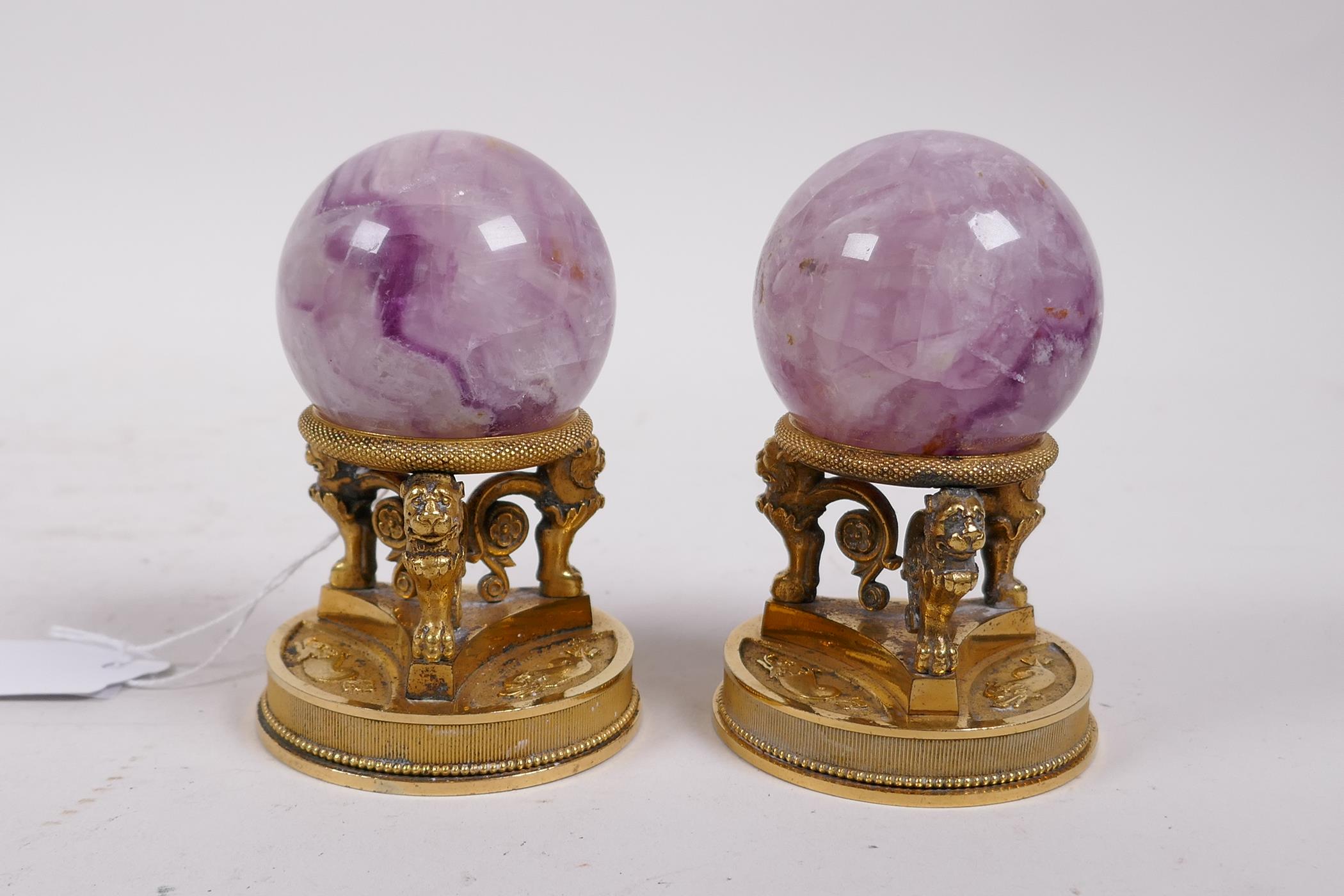 A pair of ormolu stands with lion supports, inset with crystal balls, 4" high - Image 2 of 4