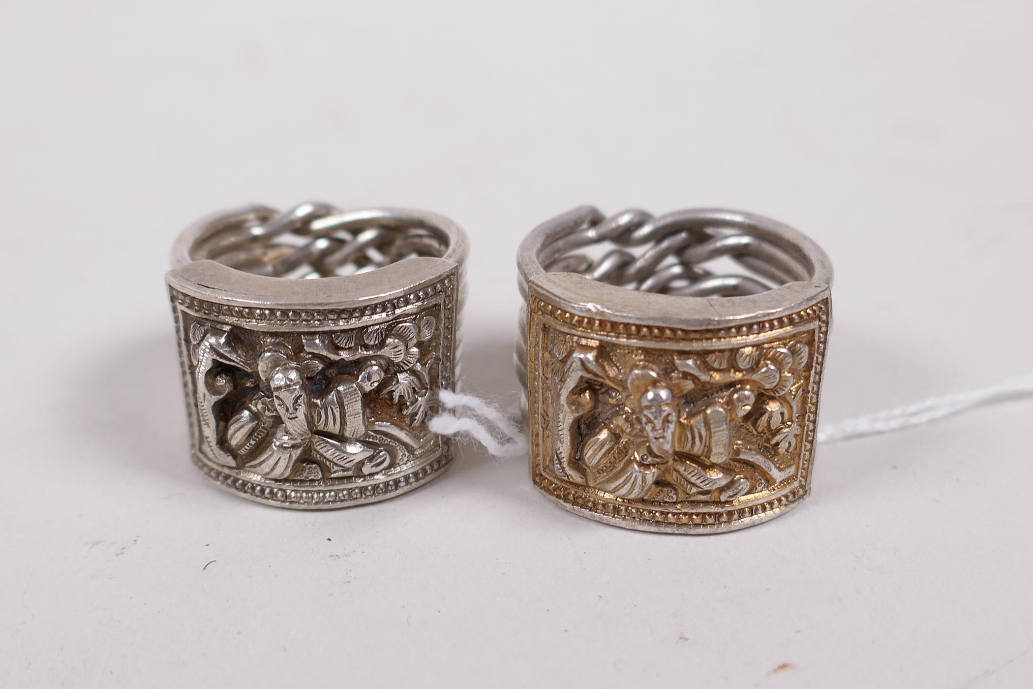 Two Chinese white metal nine link rings, with repousse decoration of a sage - Image 4 of 4