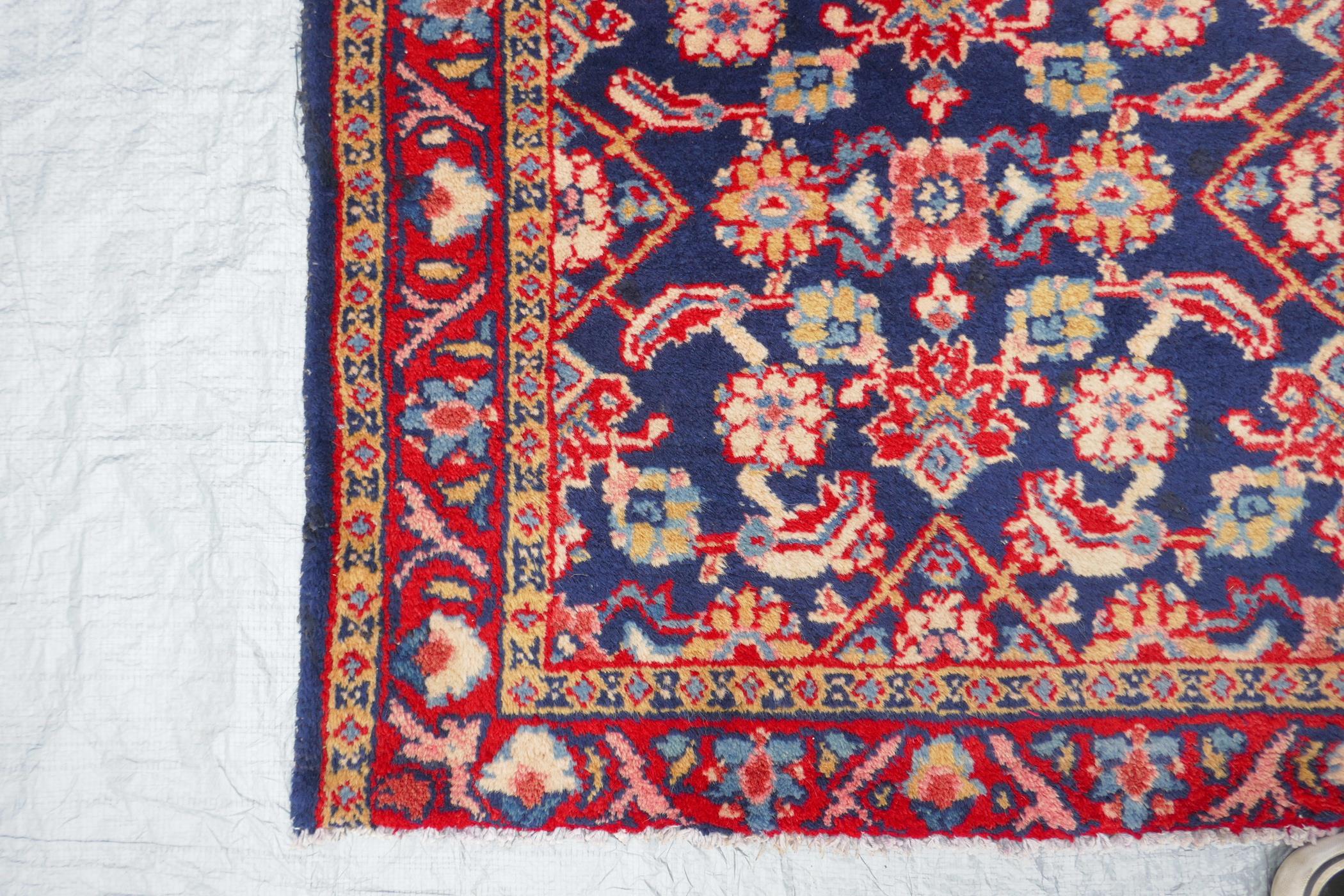 A blue ground Persian Sarouk runner with all over design and red borders, 33" x 140" - Image 6 of 8