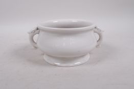 A blanc de chine porcelain censer with two handles, impressed mark to base, 5" diameter
