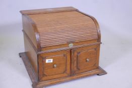 An oak cased tambour topped gramophone, 'The Progress' by Pathe, with two door sound box, 14½" high,