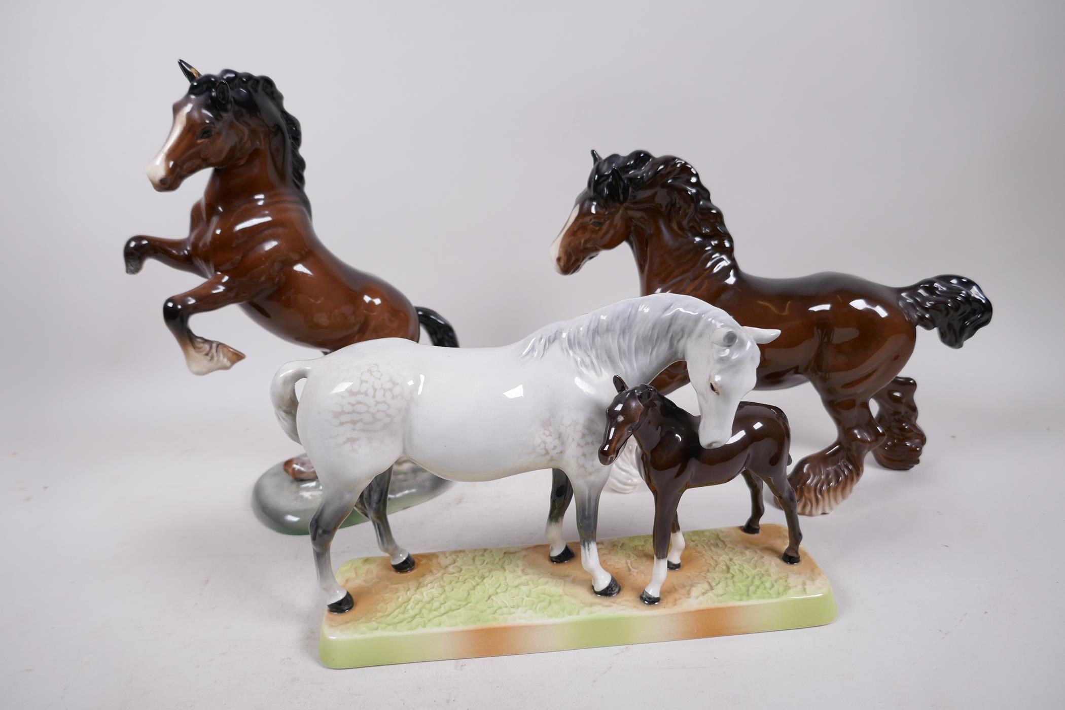 A Beswick figure of a grey mare and foal, no.1811, together with a Beswick shire horse and rearing