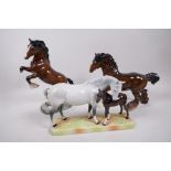 A Beswick figure of a grey mare and foal, no.1811, together with a Beswick shire horse and rearing