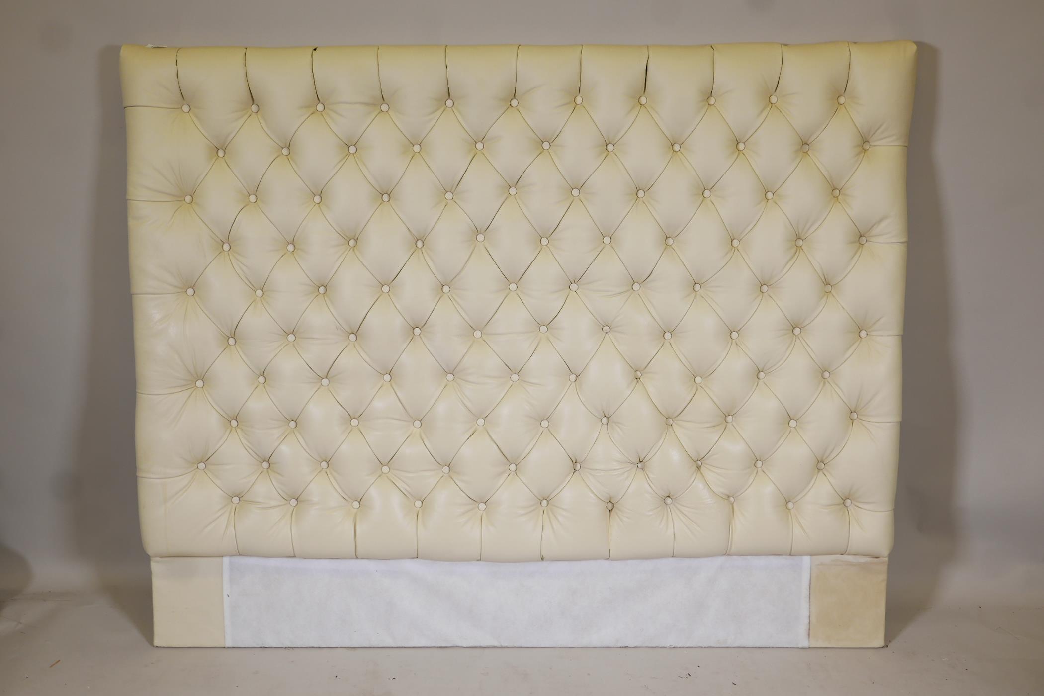 A button back leather bed headboard, 60" x 50"
